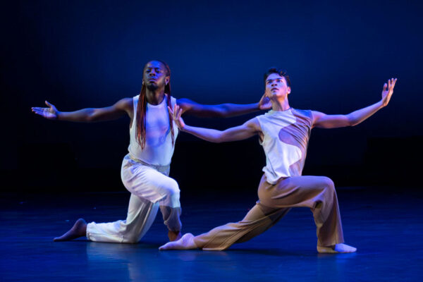 Two students perform a contemporary dance piece