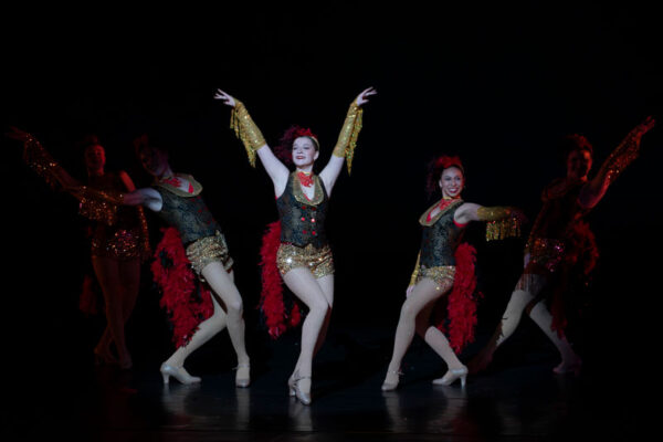 A tap group concludes their dance