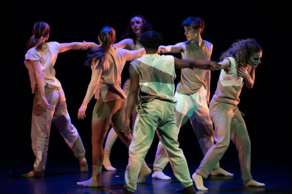A group of students perform a jazz dance piece